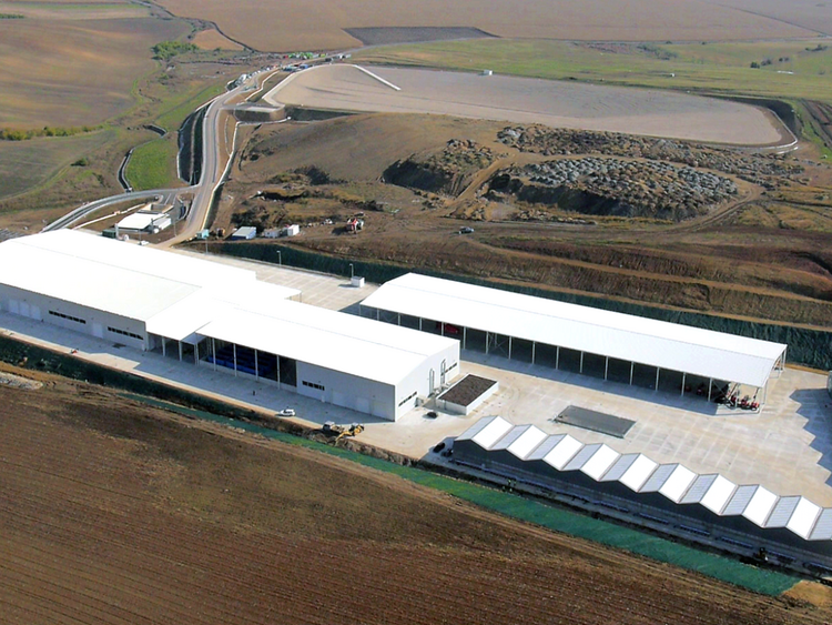 Three main tasks. Photo: aerial view of the new plant facilities; halls with white rooftops, surrounded by brown and earthy areas and roads leading to the facility