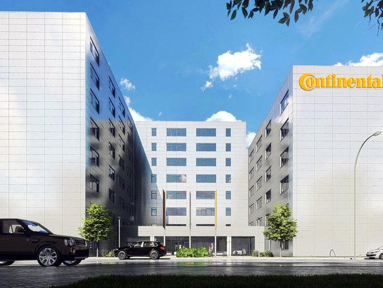 New standards. Rendering: multi-storey office building of the car tyre manufacturer Continental; view from the street side; covered entrance area with three flagpoles; on the right side of the building logo lettering in yellow; in the foreground street with one moving and two parked cars; in the background blue sky with scattered clouds